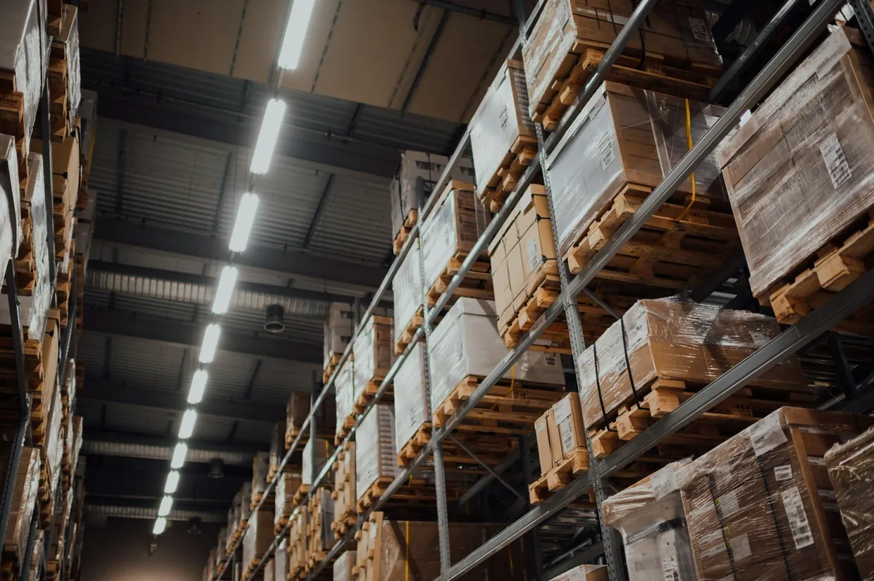 Tall warehouse racks packed with cartons, showing how stock levels build up