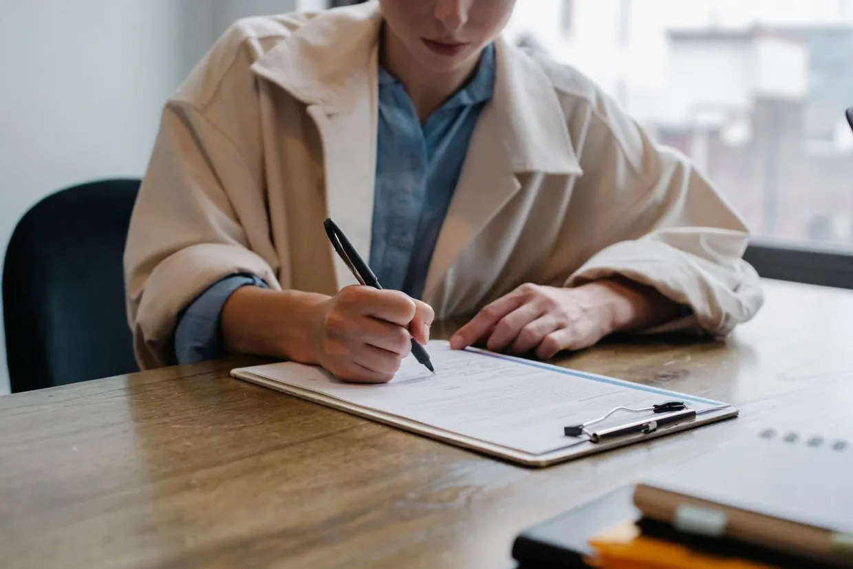 Working through a printed compliance checklist on a clipboard before starting cold calls