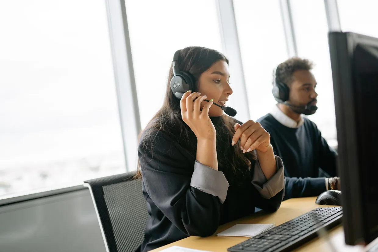Remote receptionists on headsets covering calls from a dedicated office