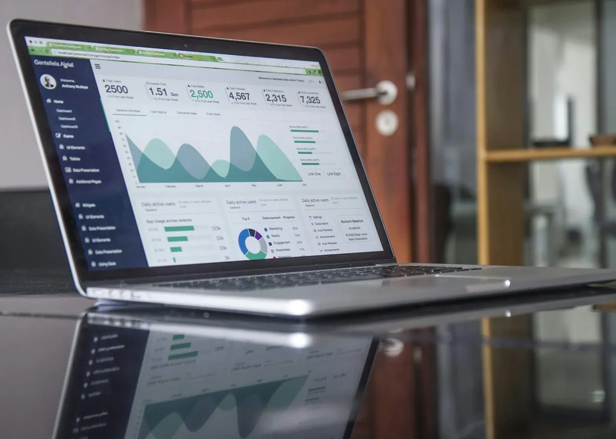 Monthly volume dashboard on a laptop, used to compare per call pricing with an hourly receptionist