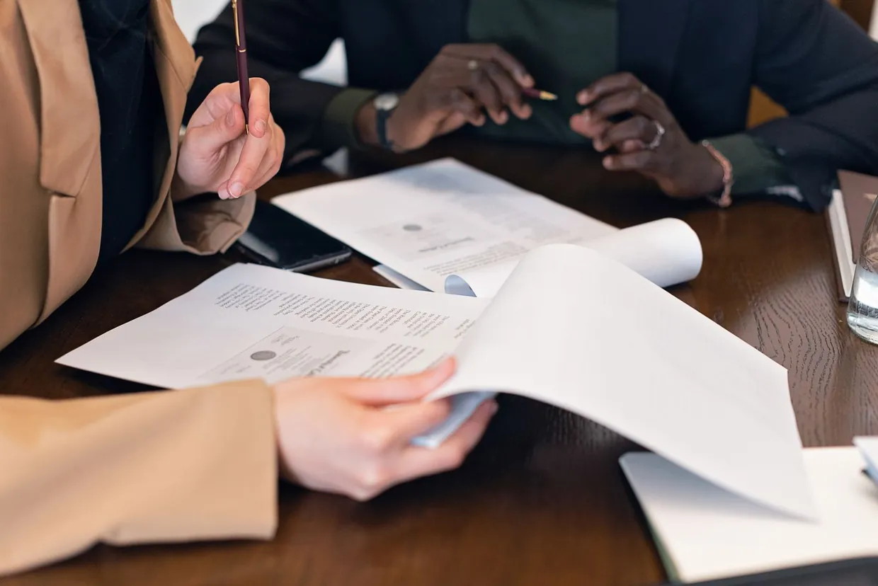 Two colleagues reviewing appointment setting options and provider terms at a meeting table