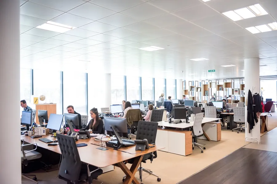 Virtual assistant team working together in a modern office