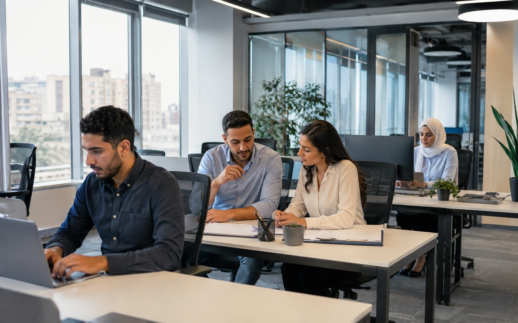 Modern Cairo office with professionals working at desks and collaborating